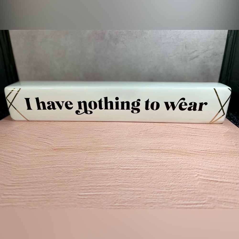 White Decorative Sign with Black Text